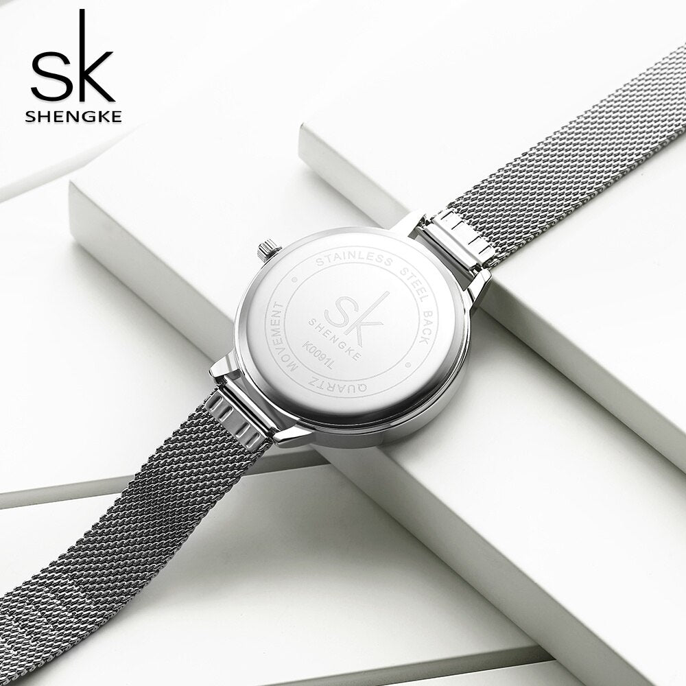 Shengke Reloj de Moda para Mujer, Creativo y Casual, con Correa de Malla de Acero Inoxidable, Elegante Diseño en Plata, Reloj de Cuarzo para Mujeres.